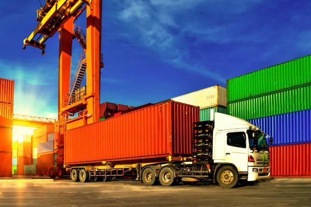 Truck moving shipping containers at a port