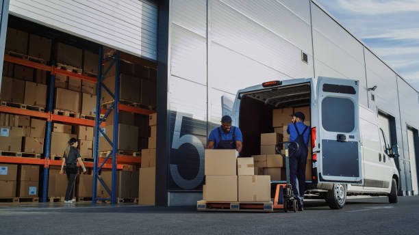 Delivery van being loaded in a warehouse
